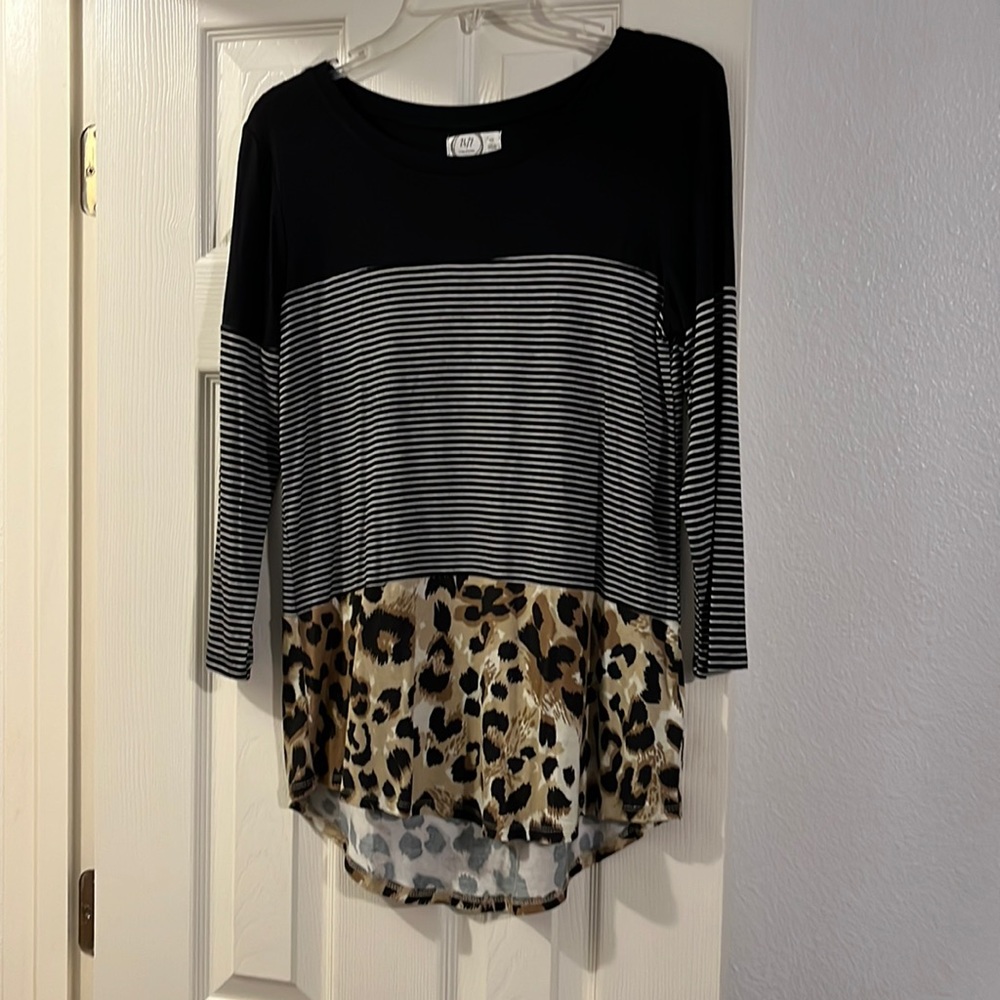 Maurice’s XS shirt stretchy material black and white stripes and animal print.